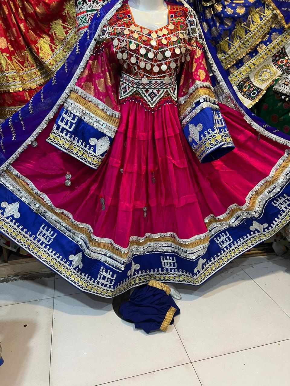 Afghan bridal dress in magenta with royal blue dupatta and silver coin embroidery on mannequin
