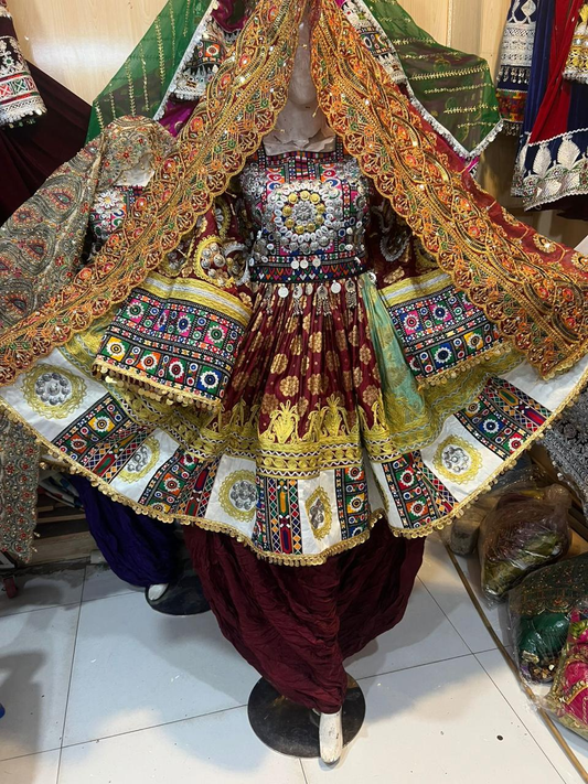 Afghan bridal dress in burgundy brocade with gold dupatta and silver mirror work bodice